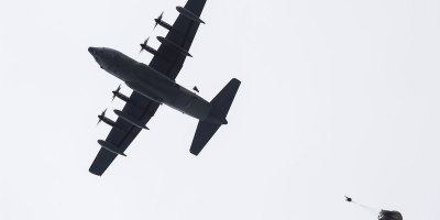 Alaska Air National Guard pararescuemen assigned to the 212th Rescue Squadron conduct a static line jump from a 211th Rescue Squadron HC-130J Combat King II during water rescue training in the Prince William Sound near Whittier, Alaska, May 16, 2024.