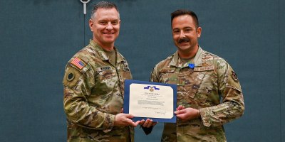 Maj. Gen. Matthew Woodruff, left, Ohio adjutant general, presents the Ohio Cross to Capt. Paul Dangelo, of the 178th Wing, during a ceremony in Springfield, Ohio, June 11, 2026.