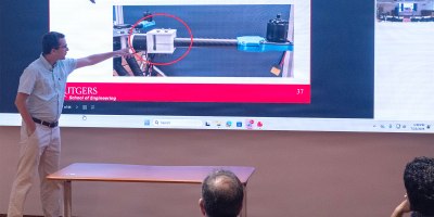 Rutgers Professor Laurent Burlion gives a presentation on “Guidance, Control, and Deployment of Multiple Custom Drones in Harsh Environments” as part of a Rutgers innovation exchange held at Picatinny Arsenal on July 22. (Photo by Todd Mozes)
