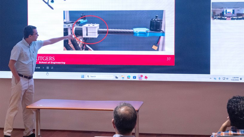 Rutgers Professor Laurent Burlion gives a presentation on “Guidance, Control, and Deployment of Multiple Custom Drones in Harsh Environments” as part of a Rutgers innovation exchange held at Picatinny Arsenal on July 22. (Photo by Todd Mozes)