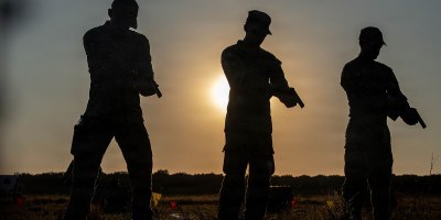 Army and Air Force reserve service members practice firing their pistols before the pistol marksmanship event August 4, 2026 near Bucharest, Romania.