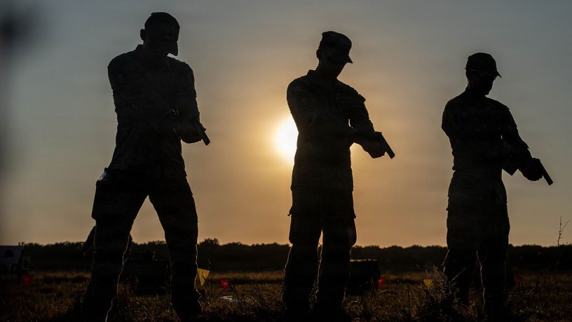 Army and Air Force reserve service members practice firing their pistols before the pistol marksmanship event August 4, 2026 near Bucharest, Romania.