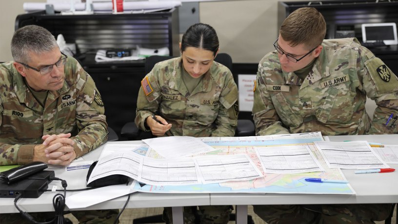 Col. David Rigg and Spc. Reyna Gonzalez, U.S. Army Soldiers assigned to the 167th Theater Sustainment Command, and Sgt. Chandler Cook, U.S. Army Soldier assigned to the 731st Combat Sustainment Support Battalion, discuss best methods to develop a wide area search team during a Texas A&M Engineering Extension Service (TEEX) National Emergency Response and Recovery Training Center Wide Area Search Course.