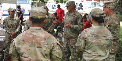 Chaplain Charles Poore, Hawaii Army National Guard senior chaplain and Maj. John Alamodin speak with Hawaii Guardsmen in the Ka’u District, Hawaii, Aug. 20, 2026.