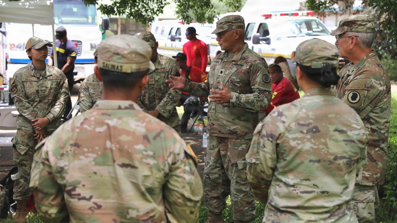 Chaplain Charles Poore, Hawaii Army National Guard senior chaplain and Maj. John Alamodin speak with Hawaii Guardsmen in the Ka’u District, Hawaii, Aug. 20, 2026.