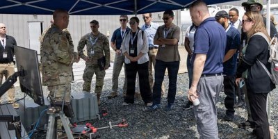 Chief Warrant Officer 2 Nathan Shea from the Pennsylvania National Guard’s Unmanned Aircraft System Training and Innovation Facility, or UASTIF, presenting the latest version of their Project Recovery Exploitation Drone at Autonomy and Robotics Day. The UASTIF collaborated with ARL scientists on improvements to the drone. (Photo credit: Greg Newswanger)