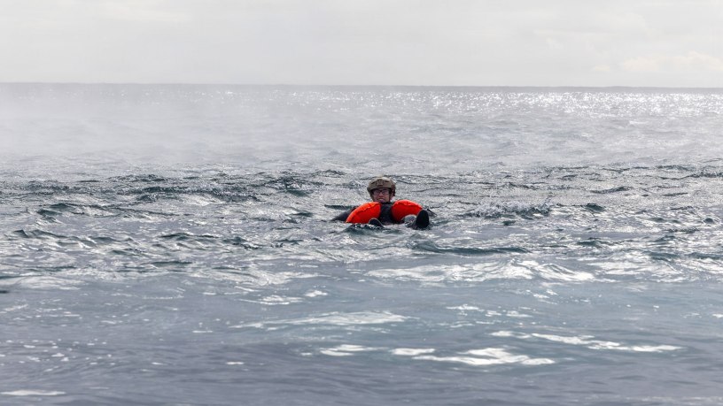 U.S. Air Force Senior Airman Spenser Ferguson, attached to the 31st Operations Support Squadron, simulates an isolated person in a maritime recovery scenario, enabling training for North Atlantic contingency operations on land or at sea during exercise Northern Viking 26 (NV26) in Keflavik, Iceland, Aug. 28, 2026.