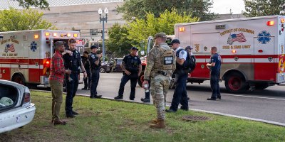 U.S. Army National Guardsmen assigned to Joint Task Force-District of Columbia (JTF-DC) in support of the DC Safe and Beautiful mission, provide medical support alongside Metro Police Department and Emergency Medical Services during a car accident at the DC Armory in Washington, Aug. 28, 2026.