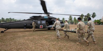 U.S. Soldiers assigned to the 11th Airborne Division take a mock casualty onto a U.S. Army UH-60 Black Hawk during cold and hot load medical evacuation training as part of Super Garuda Shield 26 at Baturaja Combat Training Center, Indonesia, Aug. 31, 2026.