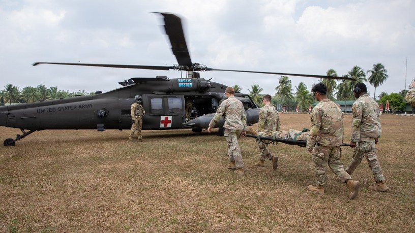 U.S. Soldiers assigned to the 11th Airborne Division take a mock casualty onto a U.S. Army UH-60 Black Hawk during cold and hot load medical evacuation training as part of Super Garuda Shield 26 at Baturaja Combat Training Center, Indonesia, Aug. 31, 2026.