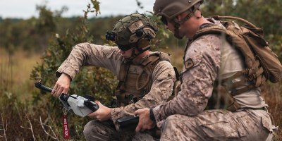 U.S. Marine Corps Cpl. Aidan Greene, left, a vehicle commander with Battalion Landing Team, 1st Battalion, 8th Marines, 6th Marine Regiment, and Cpl. Trevor Oceguera, a drone operator, also with BLT 1/8, prepare a Bolt-M autonomous air vehicle for launch during an organic loitering munitions range at Marine Corps Base Camp Lejeune, North Carolina, Aug. 28, 2026.