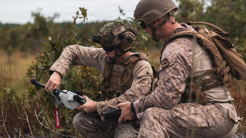 U.S. Marine Corps Cpl. Aidan Greene, left, a vehicle commander with Battalion Landing Team, 1st Battalion, 8th Marines, 6th Marine Regiment, and Cpl. Trevor Oceguera, a drone operator, also with BLT 1/8, prepare a Bolt-M autonomous air vehicle for launch during an organic loitering munitions range at Marine Corps Base Camp Lejeune, North Carolina, Aug. 28, 2026.