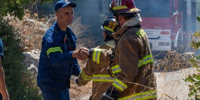Firefighters from Naval Support Activity (NSA) Souda Bay Fire & Emergency Services and the host-nation Chania Fire Department respond to a brush fire near the installation in Mouzouras, Crete, Greece, Sept. 1, 2026.