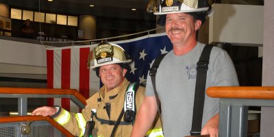 Firefighters climb stairs at Fort Rucker's Soldier Service Center to remember the lives lost on Sept. 11, 2001.