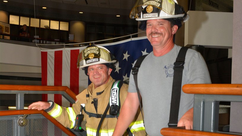 Firefighters climb stairs at Fort Rucker's Soldier Service Center to remember the lives lost on Sept. 11, 2001.