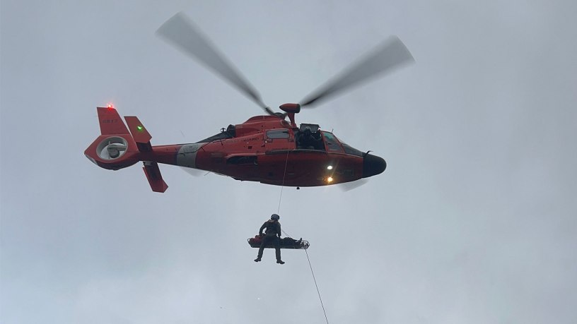 An aircrew from the U.S. Coast Guard Air Station North Bend hoists and injured hiker from a lava field near North Sister, Oregon, Saturday, Sept. 5, 2026. Due to loose rock and steep terrain, the ropes team could neither hike the patient out nor create anchors for a safe rope rescue. (U.S. Coast Guard Video Courtesy of Air Station North Bend)