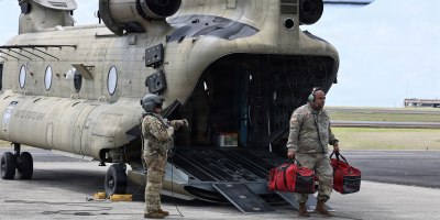 U.S. Army Sgt. 1st Class Tenifa Naufa, left, assigned to Bravo Battery, 1st Battalion, 487th Field Artillery Regiment, 29th Infantry Brigade Combat Team,Hawaii Army National Guard, left, and Sgt. Durana Amoncio, 2nd Battalion, 211th Aviation Regiment, verifies provisions after landing in Lihue, Hawaii Sept. 5, 2026.