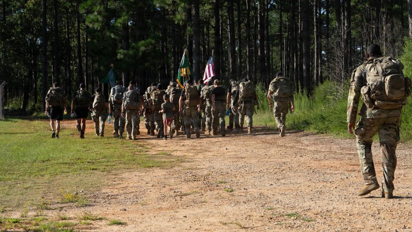U.S. Army Soldiers march for the 2026 9/11 memorial PSYOP Regimental Ruck March, at Fort Bragg, North Carolina, Sept. 10, 2026. During the ruck march the flag is moved between units and soldiers for a continuous 24 hours. (U.S. Army photo by Spc. Sydney Sepulveda)