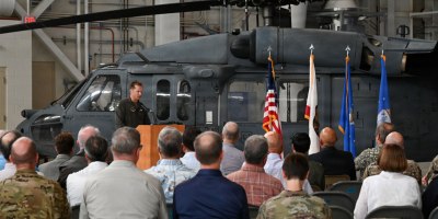Airmen and guests celebrate the divestment of the last operational HH-60G Pave Hawk helicopter during a ceremony at the 129th Rescue Wing at Moffett Air National Guard Base, California, on Sept. 10, 2026.