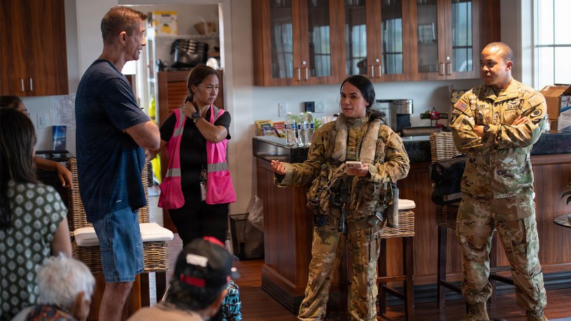 U.S. Army Sgt. Durana Amoncia, center, assigned to Bravo Company, 2nd Battalion, 211th Aviation Regiment, Hawaii Army National Guard, provides a pre-flight safety briefing to civilian passengers, Lihue, Hawaii, Sept 10, 2026.