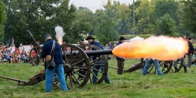 Visitors watch as historic reenactors perform a tactical artillery demonstration during the third annual Army Expo at the U.S. Army Heritage and Education Center in Carlisle, Pa., Sept. 13, 2026.