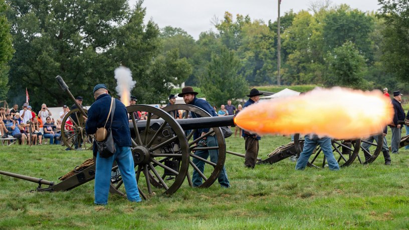 Visitors watch as historic reenactors perform a tactical artillery demonstration during the third annual Army Expo at the U.S. Army Heritage and Education Center in Carlisle, Pa., Sept. 13, 2026.