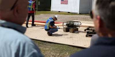 Steven Insco, a test coordinator supporting Blount Island Command, records the performance of a stand-alone pump-and-compressor configuration during an evaluation Sept. 16, 2026
