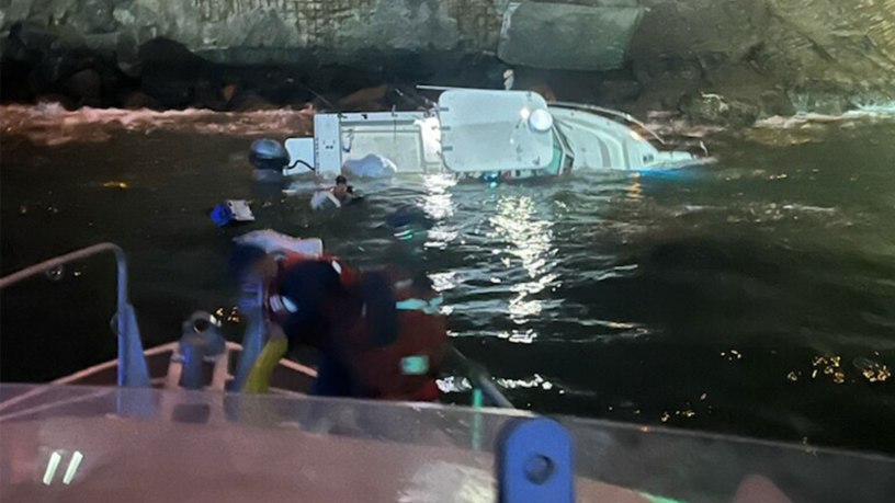 A grounded 22-foot recreational vessel rests on rocks near Lime Point Lighthouse in San Francisco, Sept. 17, 2026. Three people were rescued from the vessel by Coast Guard Station Golden Gate and San Francisco Police Department personnel. (U.S. Coast Guard courtesy photo)