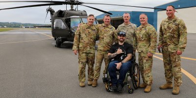 New York Army National Guard Sgt. 1st Class Jacob Pratt poses with the crew who flew his final flight aboard a UH-60 Black Hawk from Army Aviation Support Facility #3 at the Albany International Airport in Latham, NY, on September 17, 2026.