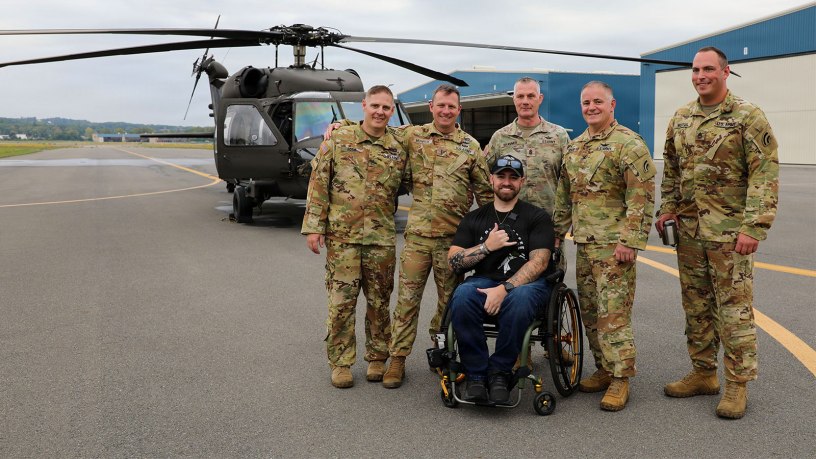 New York Army National Guard Sgt. 1st Class Jacob Pratt poses with the crew who flew his final flight aboard a UH-60 Black Hawk from Army Aviation Support Facility #3 at the Albany International Airport in Latham, NY, on September 17, 2026.