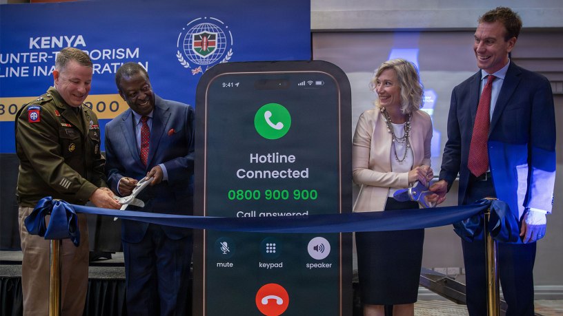 Maj. Gen. Shane P. Morgan, Commanding General of Combined Joint Task Force – Horn of Africa; Musalia Mudavadi, Kenyan Prime Cabinet Secretary; Carla Benini, U.S. Embassy Nairobi Acting Deputy Chief of Mission; and Ed Barnett, UK Deputy High Commissioner to Kenya; cut the ribbon to announce the Kenya counter-terrorism hotline, Nairobi, Kenya, Sept. 18, 2026.