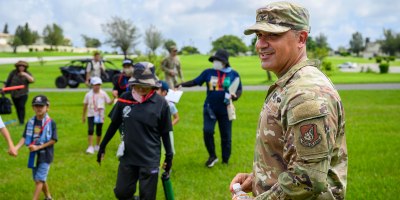 U.S. Air Force Col. Byron Buzan, 18th Mission Support Group commander, greets residents of Chatan, Japan, during a tsunami evacuation exercise at Kadena Air Base, Japan, Sept. 19, 2026.