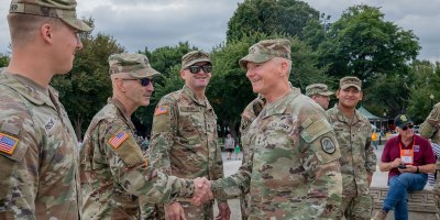 U.S. Army Maj. Gen. Stephen Osborn(right), the Adjutant General of the Iowa National Guard, greets Soldiers with the Iowa National Guard assigned to Joint Task Force-District of Columbia (JTF-DC) in support of the DC Safe and Beautiful mission before conducting a reenlistment ceremony at the Lincoln Memorial in Washington, Sept. 21, 2026.