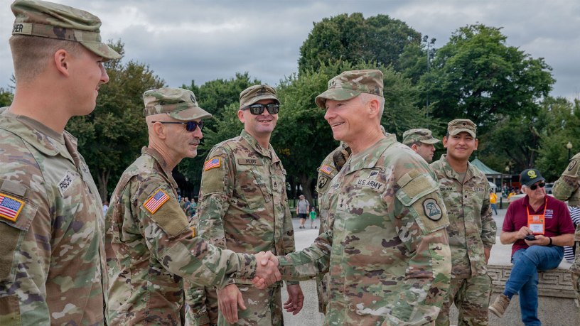 U.S. Army Maj. Gen. Stephen Osborn(right), the Adjutant General of the Iowa National Guard, greets Soldiers with the Iowa National Guard assigned to Joint Task Force-District of Columbia (JTF-DC) in support of the DC Safe and Beautiful mission before conducting a reenlistment ceremony at the Lincoln Memorial in Washington, Sept. 21, 2026.