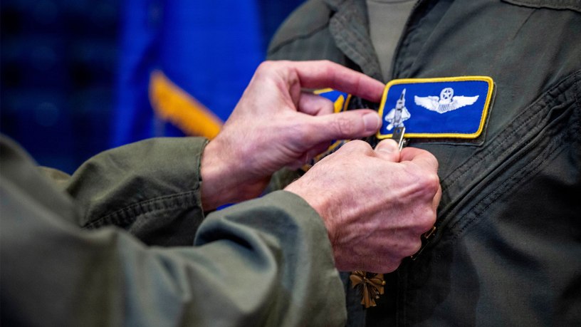 U.S. Air Force Lt. Gen. Jason T. Hinds, U.S. Air Forces in Europe – U.S. Air Forces Africa commander, pins a Distinguished Flying Cross medal onto a U.S. Air Force pilot during a ceremony in Essen, Germany, Sept. 22, 2026.