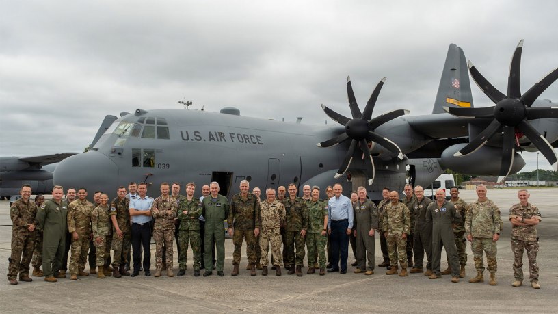 International Air Reserve Symposium delegates join for a group photo in front of a C-130H3 Hercules at Dobbins Air Reserve Base, Georgia, Sept. 24, 2026.