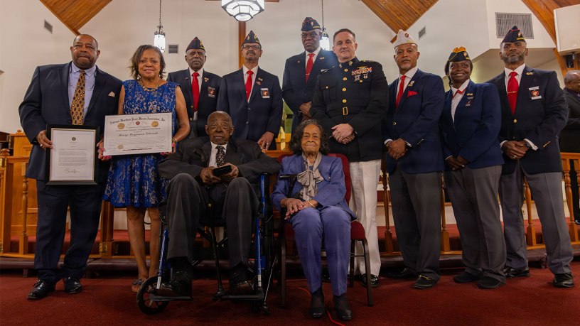 U.S. Marine Corps Maj. Gen. Douglas K. Clark, deputy commander, Marine Forces Reserve and Marine Forces South, center, and the New Orleans Montford Point Marine Association poses for a photo with retired Pfc. Henry Edwards, a Montford Point Marine, during a reception in honor of Montford Point Marines at the Bethel Ame Church in New Orleans, Sept. 27, 2026.