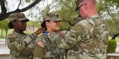 U.S. Army Sgt. Alexandria Vereen-Alaniz, senior human resources sergeant, 1st Battalion, 67th Armored Regiment, receives the Col. Robert L. Manning Achievement Medal during an Adjutant General’s Corps Regimental Association ceremony at Fort Bliss, Texas.