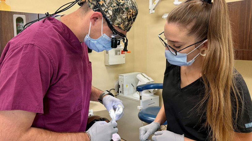 Capt. Wesley Hargett, general dentist, and Aurora Manes, dental assistant, provide dental care at Shira Dental Clinic, Fort Polk, Louisiana, Sept. 30, 2026. The pair recognized and responded to a patient experiencing anaphylaxis during a routine appointment Sept. 22.