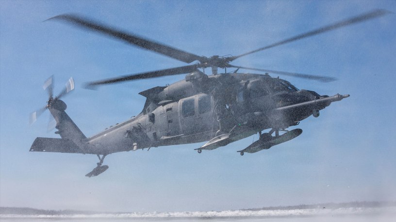 U.S. Air Force HH-60W Jolly Green II helicopter aircrew assigned to the 210th Rescue Squadron, 176th Wing, Alaska Air National Guard, approach a landing zone while evacuating simulated casualties during a full mission profile training exercise at Malemute Drop Zone, Joint Base Elmendorf-Richardson, Alaska, March 31, 2026.