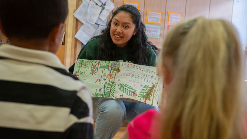 U.S. Air Force Airman 1st Class Michelle Sies, 86th Airlift Wing Public Affairs specialist and volunteer, reads a children's book to students at Kita Villa Winzig, Kaiserslautern, Germany, June 11, 2026. The German-American Reading Program is an 86th AW Host Nation Office and Kita Villa Winzig community outreach effort that introduces German children to the English language at an early age. (U.S. Air Force photo by Senior Airman Trevor Calvert)
