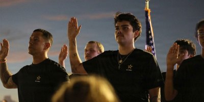 Future Soldiers joining the U.S. Army take the oath of enlistment at a candlelight vigil honoring victims of the Sept. 11, 2001, terrorist attacks, at Tempe Beach Park in Tempe, Arizona, Sept. 11, 2026.