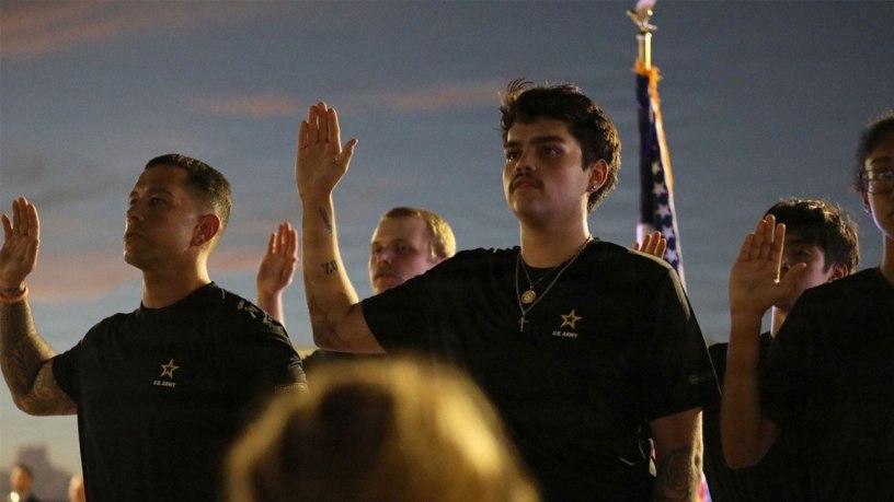 Future Soldiers joining the U.S. Army take the oath of enlistment at a candlelight vigil honoring victims of the Sept. 11, 2001, terrorist attacks, at Tempe Beach Park in Tempe, Arizona, Sept. 11, 2026.