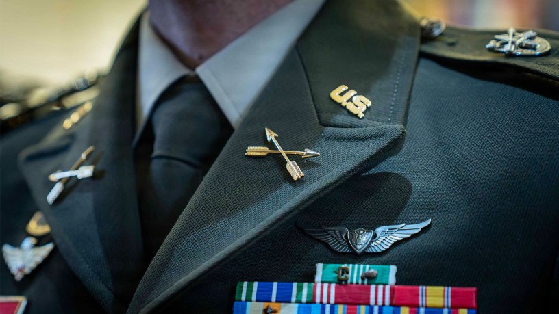 A 390A graduate dons their new Special Forces regimental distinctive insignia following the Activation and Induction ceremony at the U.S. Army John F. Kennedy Special Warfare Center and School, the Special Operations Center of Excellence, at the JFK Auditorium on Fort Bragg, N.C., Oct. 2, 2026.