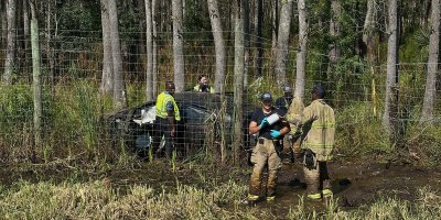 Returning from a routine medical transport in the Savannah area Sept. 28, two Soldiers from Winn Army Community Hospital stopped to assist after spotting a single-vehicle crash off southbound Interstate 95 near Exit 94.
