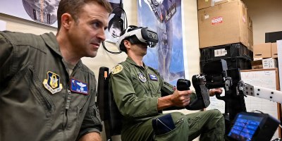 U.S. Air Force Lt. Col. Kiel Spencer, 307th Operations Group, observes as a teammate practices B-52H Stratofortress air refueling on the EARL (Experiential Air Refueling Lightweight Simulator) trainer at Barksdale Air Force Base, Louisiana, Oct. 6, 2026.