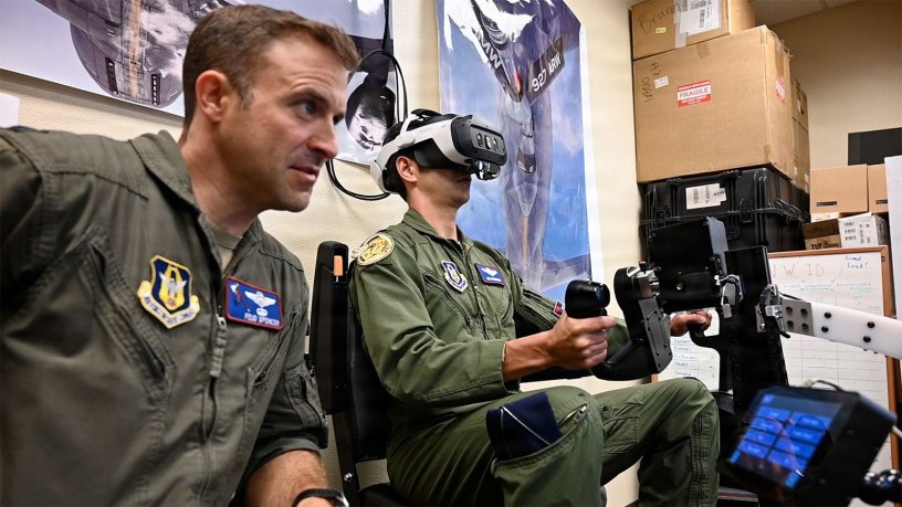 U.S. Air Force Lt. Col. Kiel Spencer, 307th Operations Group, observes as a teammate practices B-52H Stratofortress air refueling on the EARL (Experiential Air Refueling Lightweight Simulator) trainer at Barksdale Air Force Base, Louisiana, Oct. 6, 2026.