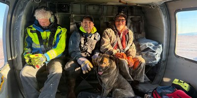 A Nome Volunteer Fire Department emergency medical technician and two rescued boaters ride in a Nome based Alaska Army National Guard UH-60L Black Hawk, assigned to the 1-168th General Support Aviation Battalion, during a rescue mission over Northwest Alaska Oct. 6, 2026.